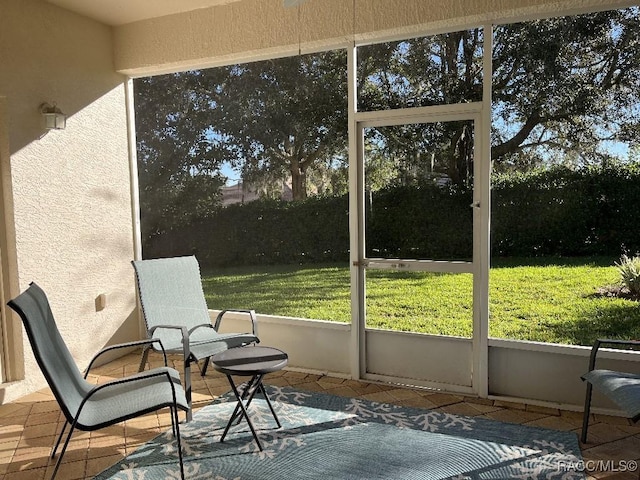 unfurnished sunroom with plenty of natural light