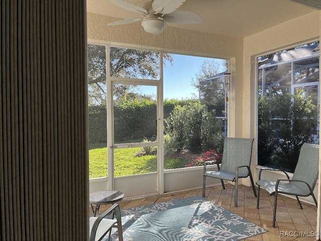 sunroom / solarium with ceiling fan