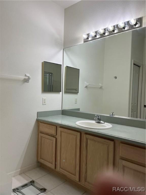 bathroom with vanity and tile patterned floors