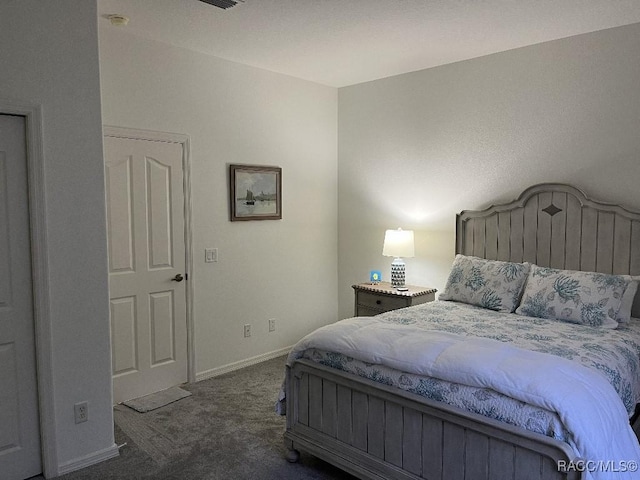 bedroom with dark carpet