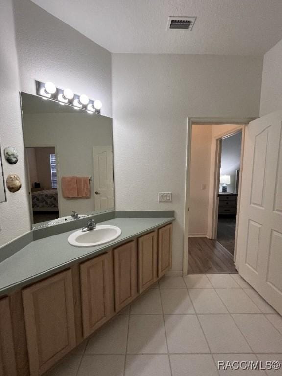 bathroom featuring tile patterned floors and vanity