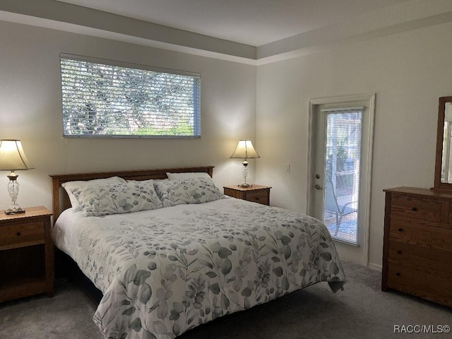 carpeted bedroom featuring access to outside