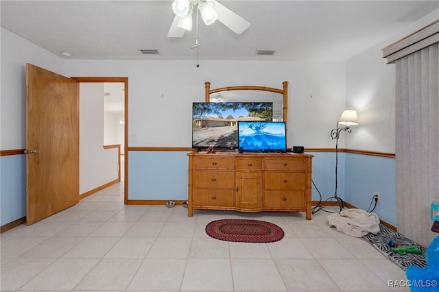 unfurnished living room with ceiling fan