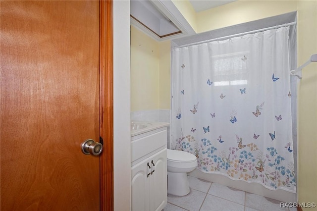 bathroom featuring toilet, vanity, tile patterned floors, and walk in shower