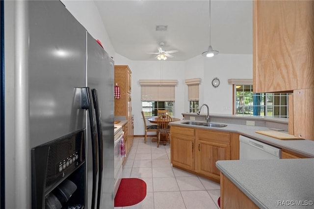 kitchen featuring ceiling fan, dishwasher, sink, stainless steel refrigerator with ice dispenser, and light tile patterned flooring