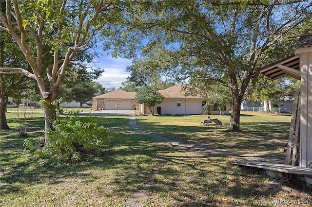 view of yard featuring a garage