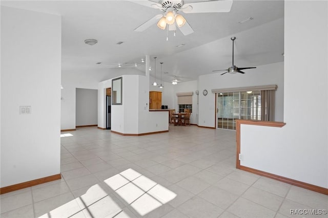 unfurnished living room with light tile patterned floors, ceiling fan, and lofted ceiling