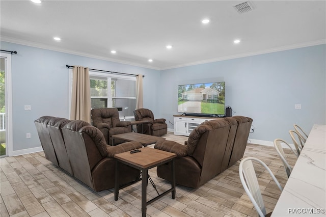 living room featuring ornamental molding and light wood-type flooring