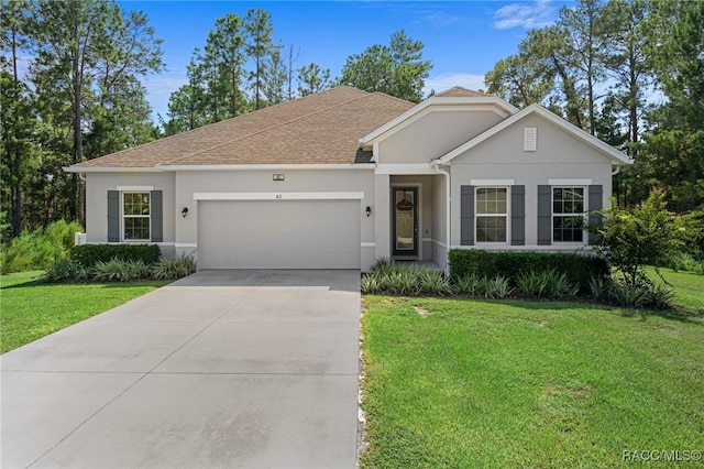 single story home with a garage and a front yard