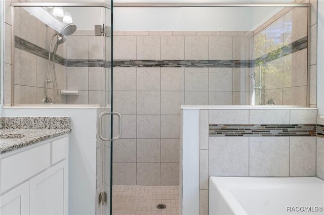 bathroom with hardwood / wood-style flooring and vanity