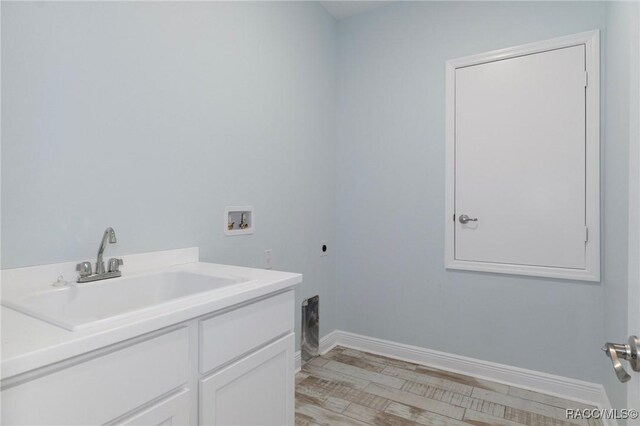 bedroom featuring a tray ceiling, light hardwood / wood-style flooring, and ornamental molding