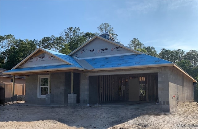 10060 N Carver Dr, Dunnellon, FL 34434 - property in mid-construction featuring concrete block siding, a garage, and driveway