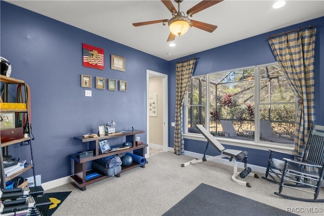 interior space with carpet flooring and ceiling fan