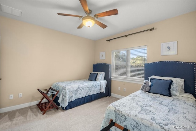 bedroom featuring ceiling fan and light colored carpet