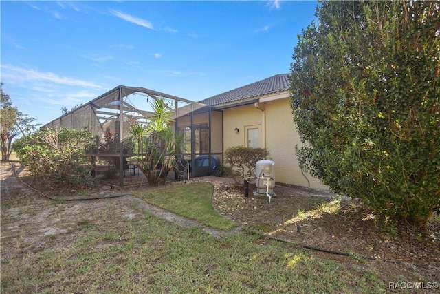 back of property with a lanai