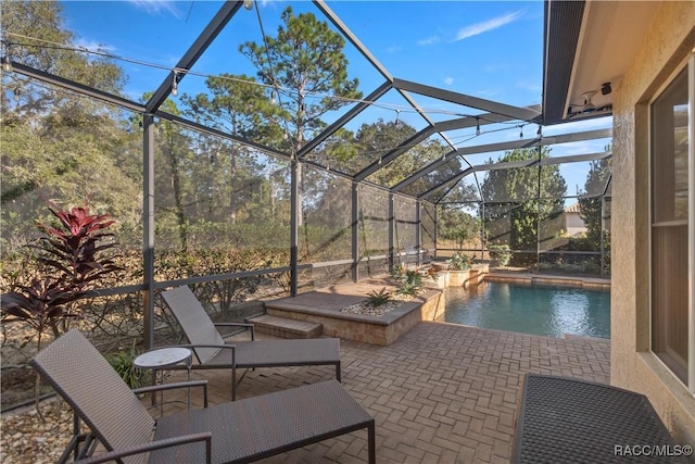 view of patio with a lanai