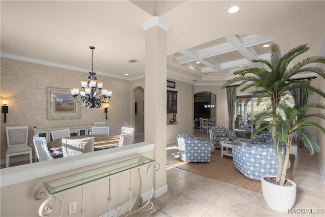 interior space with beam ceiling, an inviting chandelier, ornamental molding, and coffered ceiling