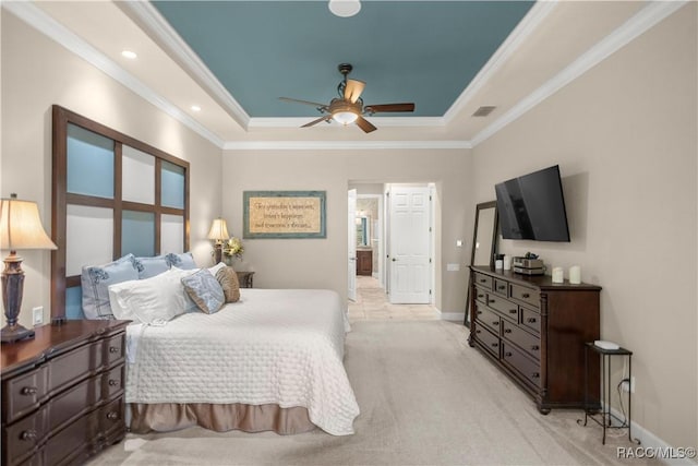 carpeted bedroom featuring a raised ceiling, ceiling fan, and ornamental molding