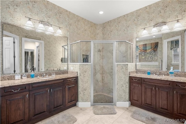 bathroom featuring tile patterned floors, vanity, and walk in shower