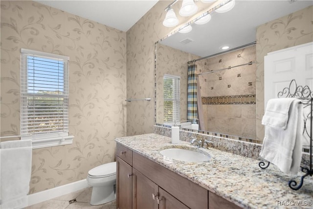 bathroom featuring tile patterned floors, vanity, curtained shower, and toilet