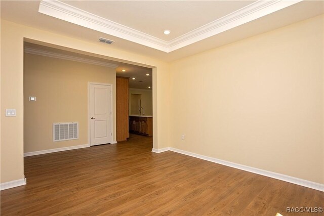 kitchen featuring sink, light hardwood / wood-style flooring, light stone countertops, and an island with sink