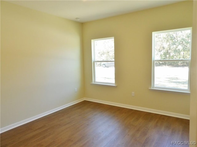 unfurnished room featuring hardwood / wood-style floors