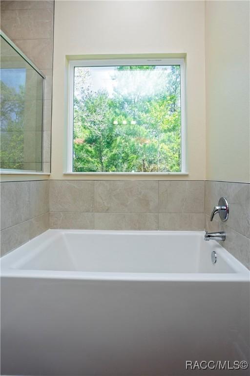 washroom with sink, cabinets, hookup for a washing machine, electric dryer hookup, and hardwood / wood-style flooring