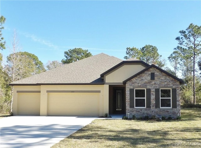 view of front facade with a garage and a front yard