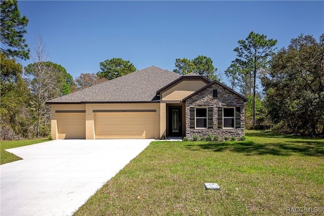 view of front facade with a front yard, driveway, an attached garage, stucco siding, and stone siding