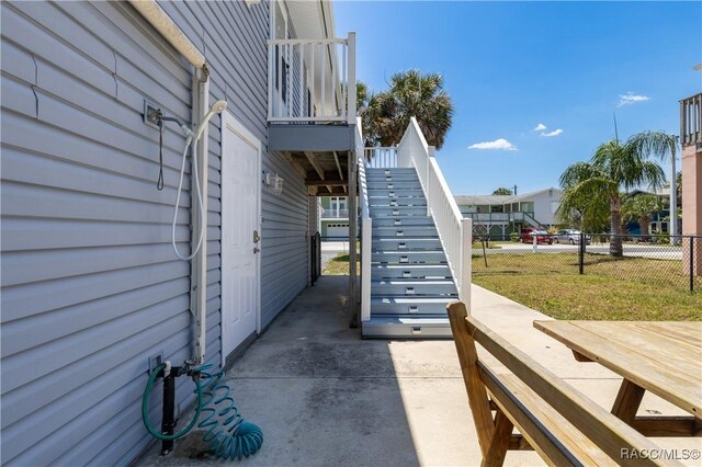 9 Flagler Dr, Palm Coast, FL 32137 - view of patio featuring stairway and fence