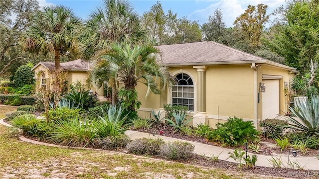 view of front of property with a garage