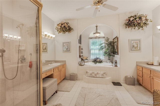 bathroom with separate shower and tub, ceiling fan, tile patterned flooring, and vanity