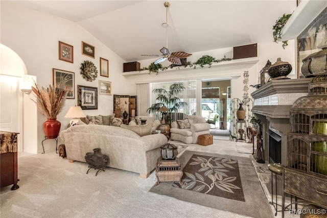 living room with carpet flooring, ceiling fan, and lofted ceiling