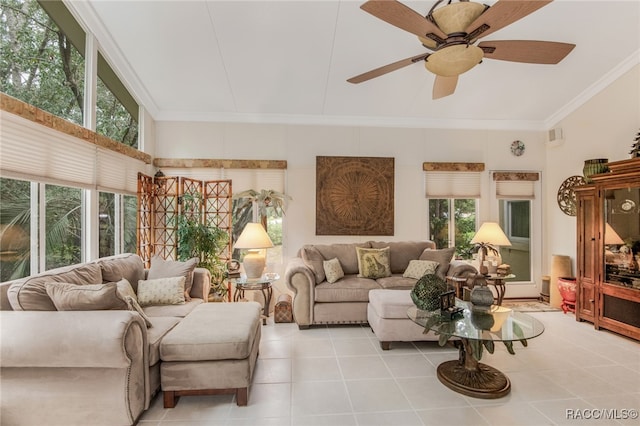 living room with a wealth of natural light, crown molding, and a towering ceiling