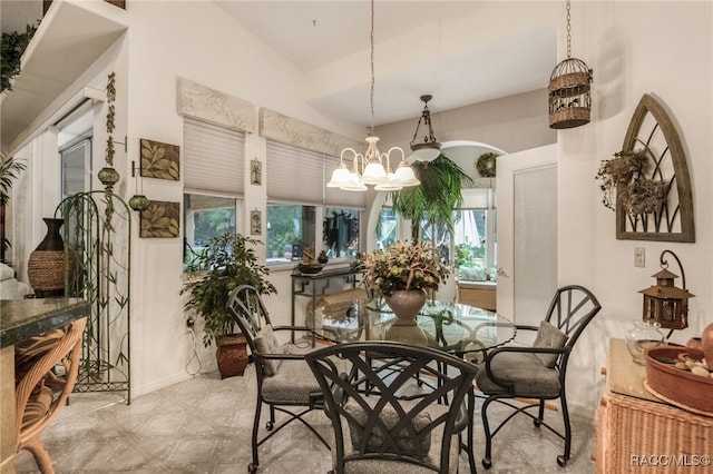 dining space featuring a notable chandelier