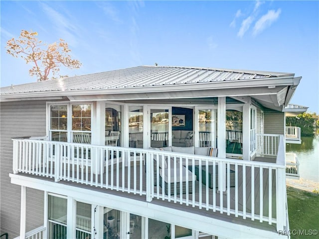 rear view of house with metal roof