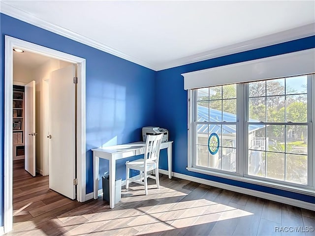 office featuring crown molding, wood finished floors, and baseboards