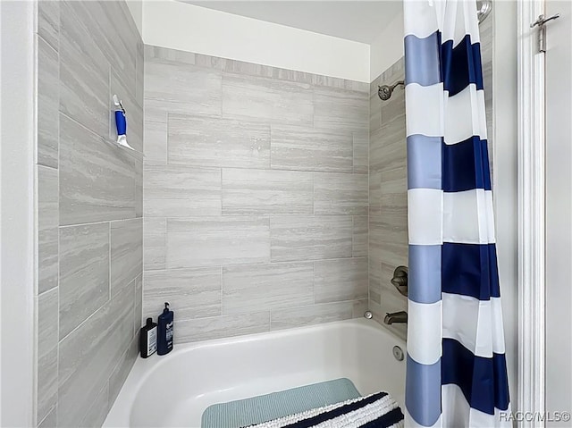 full bath featuring shower / bath combo with shower curtain