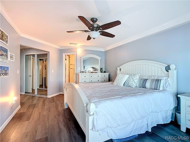 bedroom with a ceiling fan, wood finished floors, visible vents, baseboards, and ornamental molding