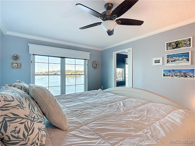 bedroom featuring ornamental molding, a water view, a ceiling fan, and access to outside