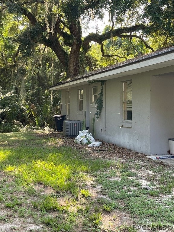 view of home's exterior with cooling unit