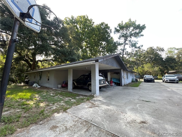 view of side of property with a carport