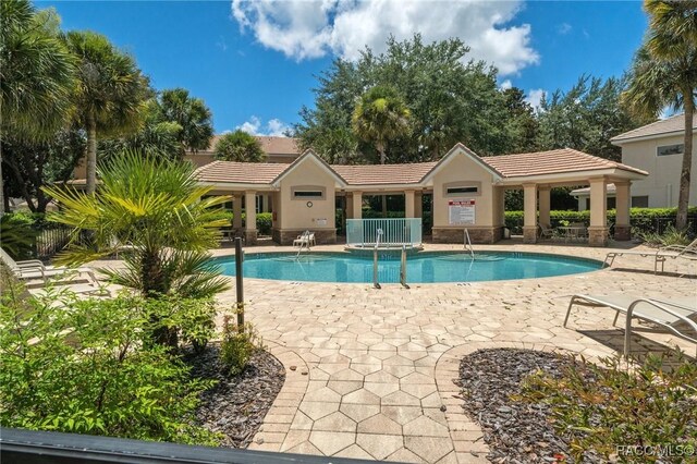community pool with a patio