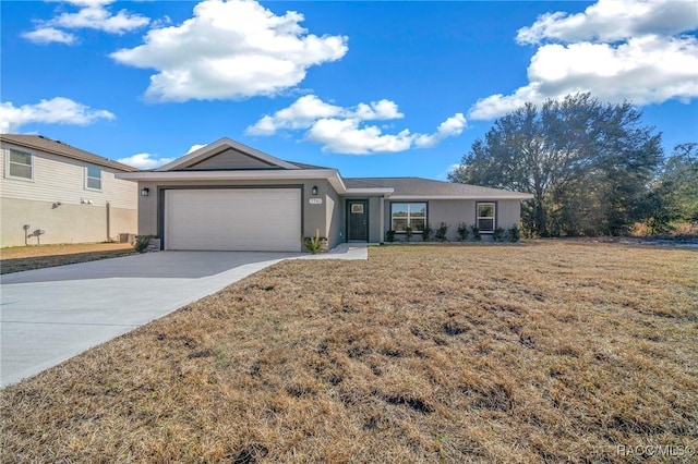 ranch-style home featuring a garage and a front yard