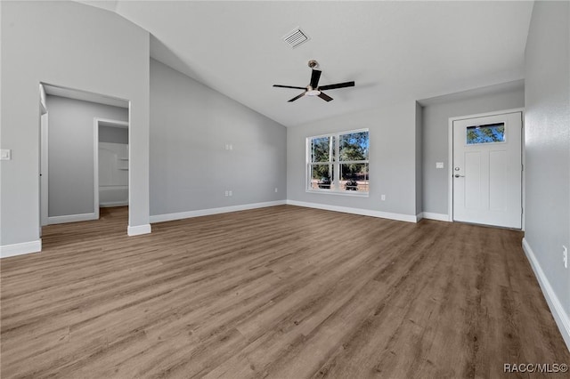 unfurnished living room with light hardwood / wood-style flooring, vaulted ceiling, and ceiling fan