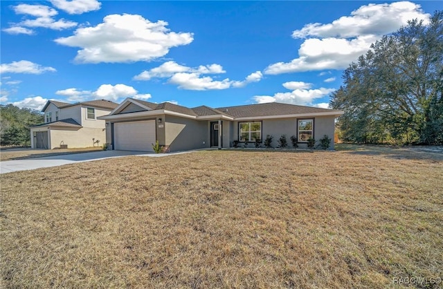 view of front of house featuring a garage and a front lawn