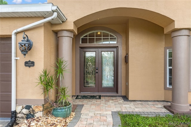 property entrance featuring french doors