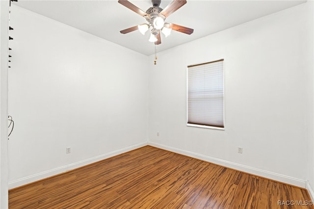 unfurnished room with hardwood / wood-style flooring and ceiling fan