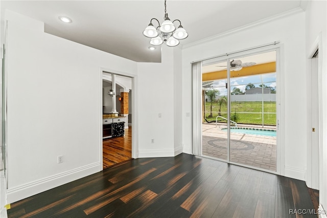 interior space with ceiling fan with notable chandelier, dark hardwood / wood-style flooring, and crown molding