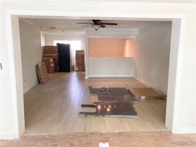 interior space featuring ceiling fan, light hardwood / wood-style floors, and ornamental molding